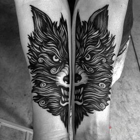 Tattoo Angry wolf on the forearm motif: animals