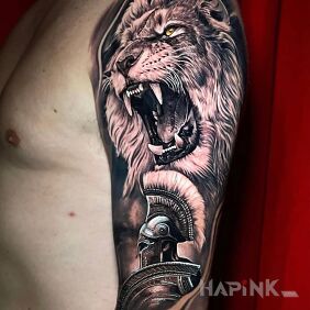 Tattoo Lion and warrior On the arm motif: animals style: realistic
