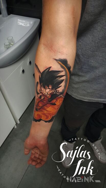 Tattoo Songo Wjechał na łapke in characters motif and japanese / irezumi style on the forearm