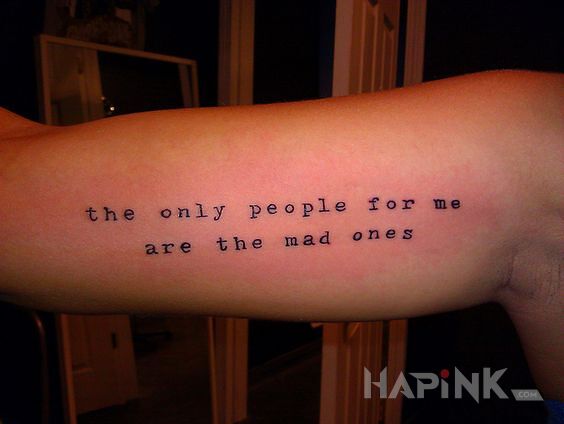 Tattoo Szaleni ludzie in lettering motif On the arm