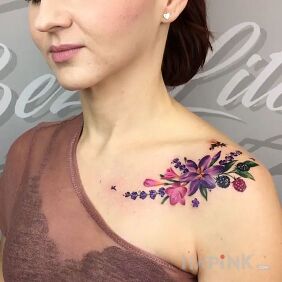 Tattoo Purple flower on the collarbone motif: floral style: realistic