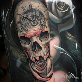 Tattoo Clock, skull and rose on the forearm motif: flowers