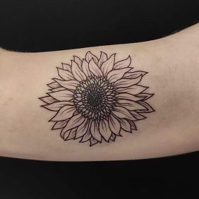 Tattoo Sunflower On the arm motif: black and gray style: blackwork / blackout