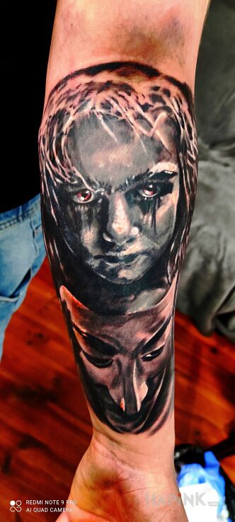 Tattoo Mroczna dziewczynka in faces motif and realistic style On the arm