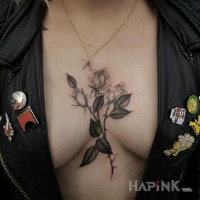 Tattoo 3 roses on the breast motif: black and gray style: realistic