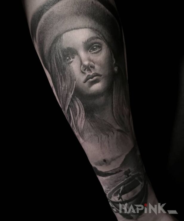 Tattoo Portret dziewczyny in faces motif and realistic style On the arm