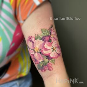 Tattoo Apple blossoms On the arm motif: colorful style: realistic