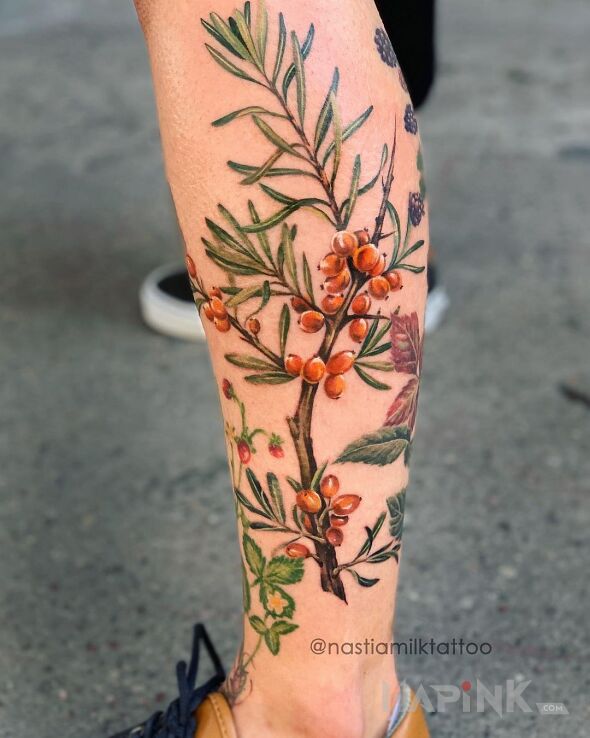 Tattoo Gałązka rokitnika in nature motif and realistic style on the calf