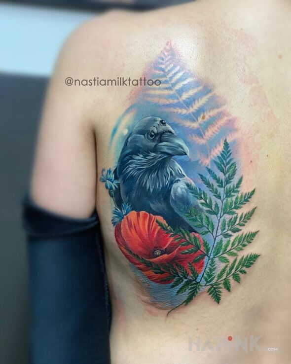 Tattoo Kruk in flowers motif and realistic style on the shoulder blades