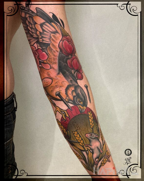 Tattoo Atak in flowers motif and neo-traditional style On the arm