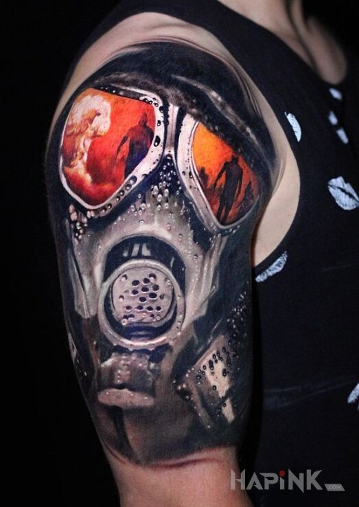 Tattoo Maska in war motif and realistic style on the upper arm