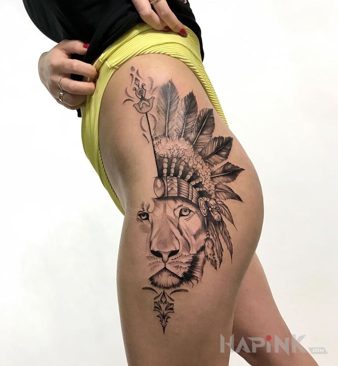 Tattoo Lew in black and gray motif and graphic / illustrative style on the thigh