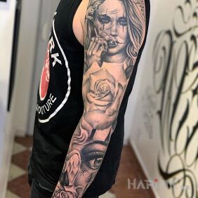 Tattoo Roses with a girl or a girl with roses? on the upper arm motif: flowers style: realistic