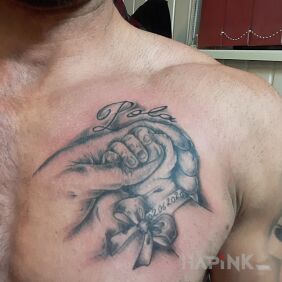 Tattoo On the occasion of the birth of a child on the chest motif: black and gray style: realistic