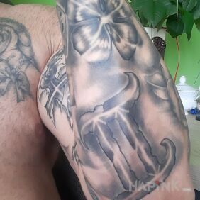 Tattoo Zodiac sign on the forearm motif: black and gray style: graphic / illustrative