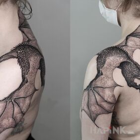 Tattoo Huge dragon on the shoulder motif: black and gray style: realistic