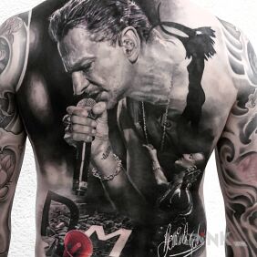 Tattoo Linkin Park band singer on the back motif: faces style: realistic