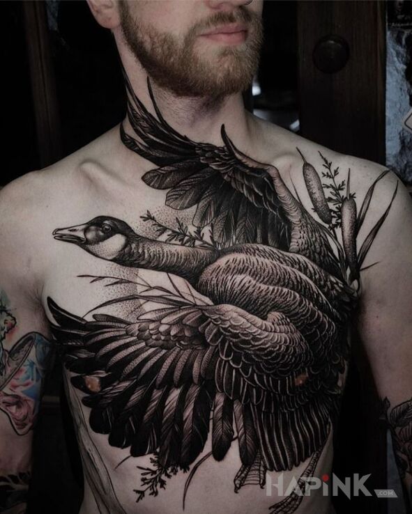 Tattoo Kaczka in black and gray motif and realistic style on the collarbone