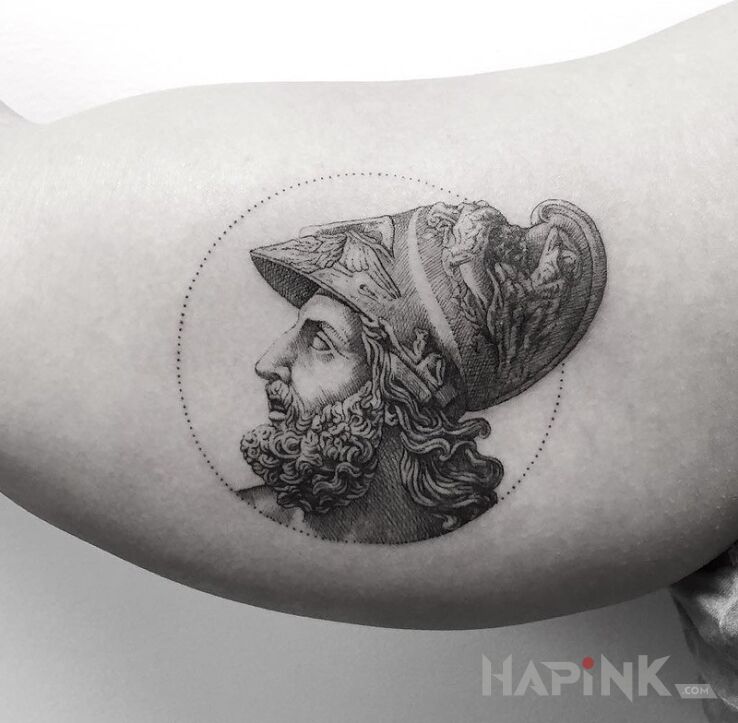 Tattoo Menelaos in characters motif on the upper arm