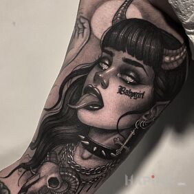 Tattoo Devil's girl on the bicep motif: faces style: graphic / illustrative