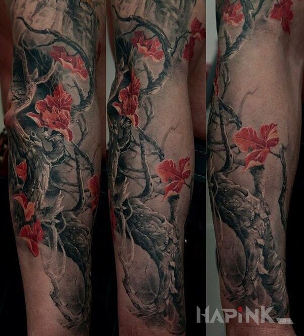 Tattoo Gałązka in flowers motif and realistic style on the forearm