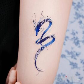 Tattoo Water dragon on the upper arm motif: dragons style: graphic / illustrative