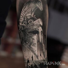 Tattoo Marching army On the arm motif: black and gray style: realistic
