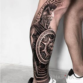 Tattoo Wojak with a shield on the tibia motif: black and gray style: realistic