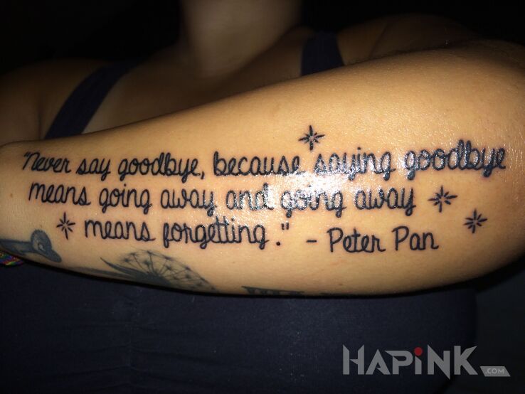 Tattoo Cytat z piotrusia pana in lettering motif and calligraphy style on the forearm