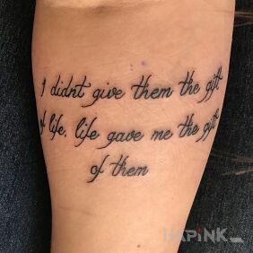 Tattoo Gift from life on the forearm motif: lettering
