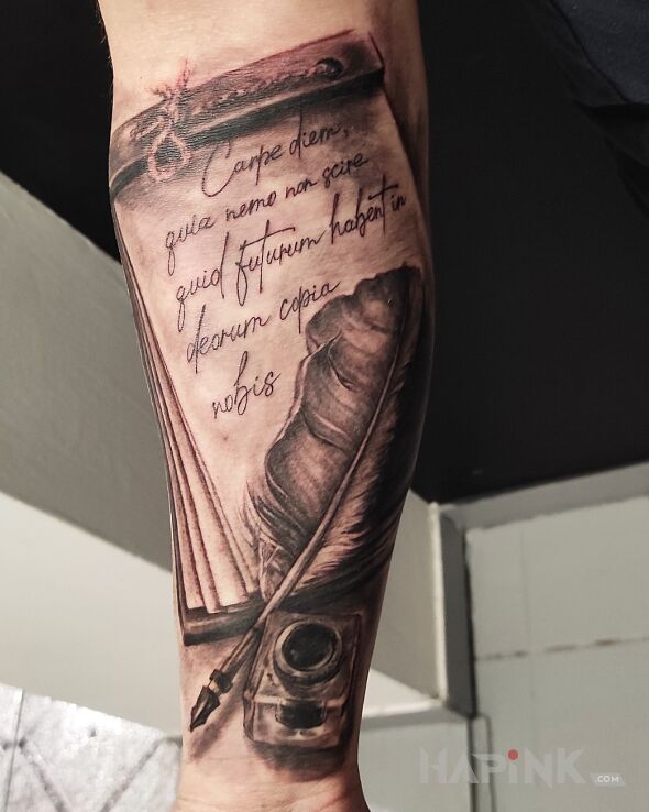 Tattoo Inkwell with a pen quote in objects motif and calligraphy style on the forearm
