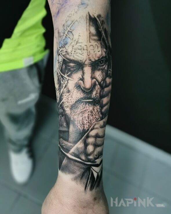 Tattoo In progress in faces motif and realistic style on the forearm