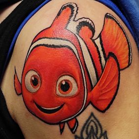 Tattoo Where is Nemo? On the arm motif: characters style: cartoon / comic book