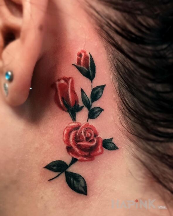 Tattoo Rose in flowers motif and realistic style behind the ear