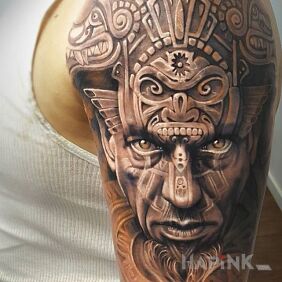 Tattoo Aztek on the upper arm motif: characters style: realistic