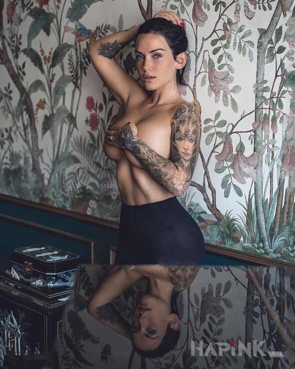 Tattoo Mala czarna in sexy motif and realistic style on the forearm