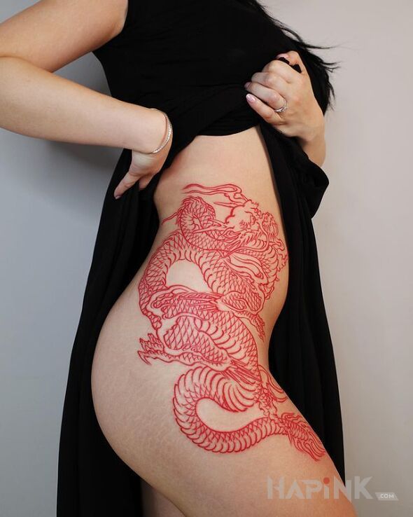 Tattoo Czerwony smok in colorful motif and contour / linework style on the ribs