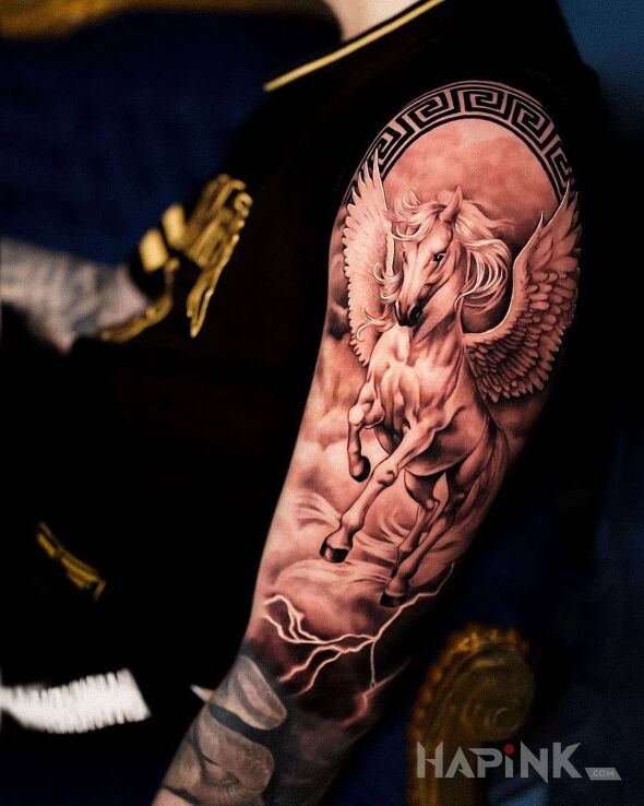 Tattoo Pegaz in black and gray motif and realistic style On the arm