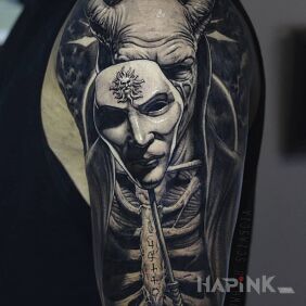 Tattoo Devil behind the mask On the arm motif: demons style: realistic