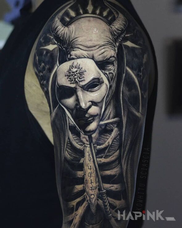 Tattoo Diabeł za maską in black and gray motif and realistic style On the arm