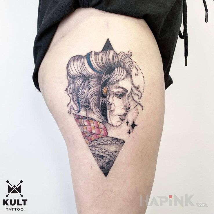 Tattoo KOBIETA in black and gray motif and dotwork style on the leg