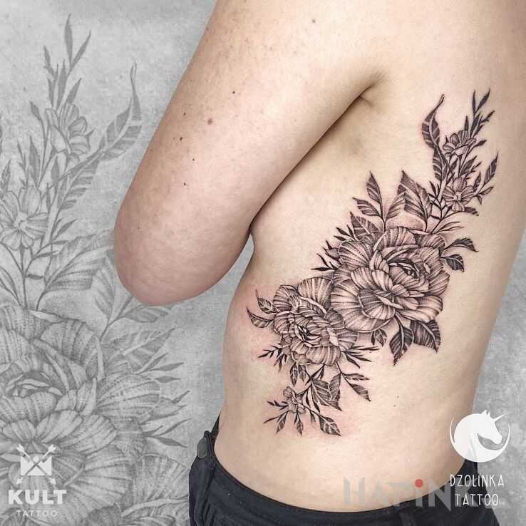 Tattoo KWIATY in black and gray motif and graphic / illustrative style on the ribs