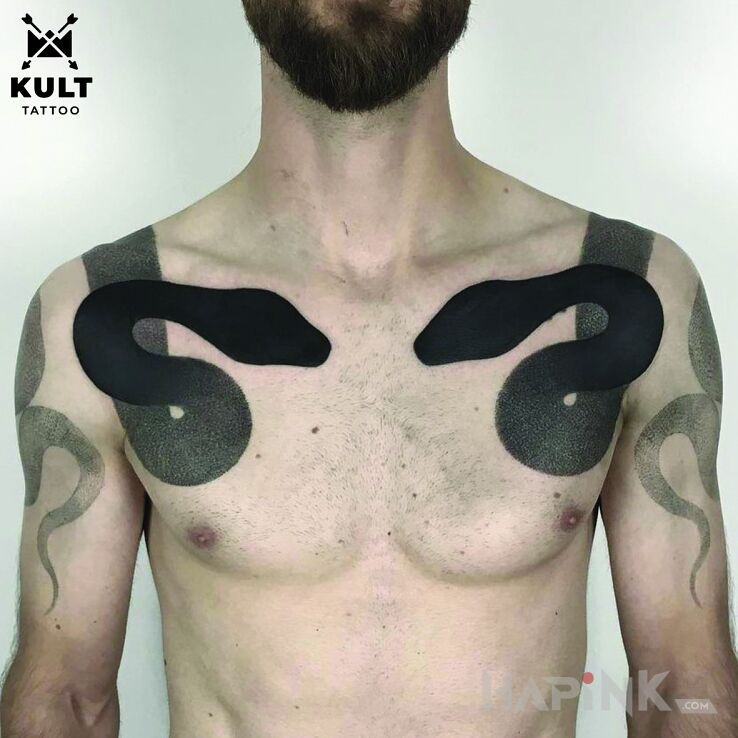 Tattoo WĘŻE in black and gray motif and blackwork / blackout style on the upper arm