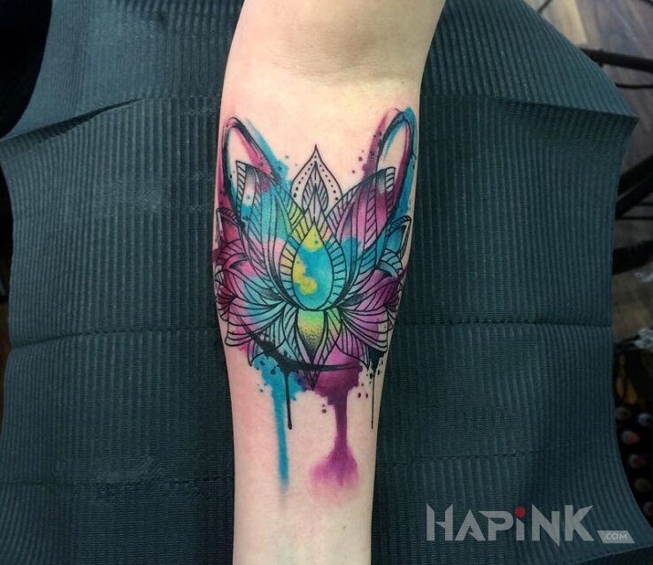 Tattoo Kwiat lotosu in flowers motif on the forearm