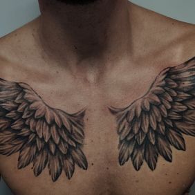 Tattoo Wings on the collarbone motif: wings style: realistic