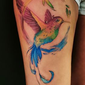 Tattoo Bird of Paradise on the thigh motif: colorful style: Watercolor