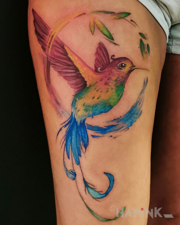 Tattoo Bird of Paradise in colorful motif and Watercolor style on the leg