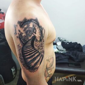 Tattoo Clock start of the sleeve on the upper arm motif: objects style: surrealistic