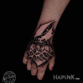 Tattoo With a heart on the hand! on the hand motif: black and gray style: graphic / illustrative