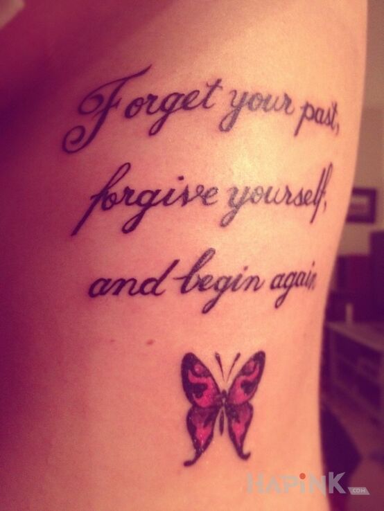Tattoo Napis i motylek in lettering motif on the ribs